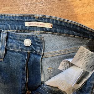 Levi’s 721 high rise skinny distressed jeans